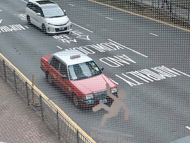 Accidentally funny street photo by Edas Wong.